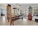 Bright dining room with a rustic wood table, bench, and access to the screened lanai at 21320 Paradise Way, Eustis, FL 32736