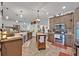 Spacious kitchen with stainless appliances, a center island, and ample counter space, perfect for cooking and entertaining at 21320 Paradise Way, Eustis, FL 32736