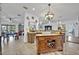 Charming kitchen featuring an island with wine rack and an open layout perfect for entertaining at 21320 Paradise Way, Eustis, FL 32736