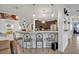 Kitchen view features bar seating, pendant lighting, and an open design to the rest of the home at 21320 Paradise Way, Eustis, FL 32736