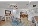 Inviting living room showcasing an open concept design with easy access to the kitchen area at 21320 Paradise Way, Eustis, FL 32736