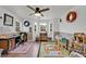 Bright home office with multiple windows and unique decor at 21320 Paradise Way, Eustis, FL 32736