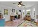 Bright home office featuring multiple windows and wood accents at 21320 Paradise Way, Eustis, FL 32736
