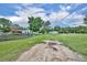 Expansive property featuring fenced yard, green pastures, and multiple outbuildings at 21320 Paradise Way, Eustis, FL 32736