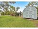 A tidy shed in the backyard adds extra storage space, blending seamlessly into the lush surroundings at 2163 County Road 243F, Wildwood, FL 34785
