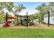 Lush backyard with garden shelter is great for growing plants in warm weather at 2163 County Road 243F, Wildwood, FL 34785