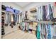 Walk-in closet with ample storage space, featuring wire shelving and racks at 2163 County Road 243F, Wildwood, FL 34785