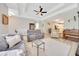 Open-concept living area featuring modern furniture and stylish decor with wood-look flooring at 2163 County Road 243F, Wildwood, FL 34785