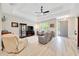 Inviting living room with comfortable seating and wood-look floors, creating a cozy atmosphere at 2163 County Road 243F, Wildwood, FL 34785