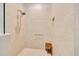 Walk-in shower with glass door, tiled walls, and built-in seat at 2163 County Road 243F, Wildwood, FL 34785