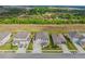 Aerial view showcasing the house and the neighborhood with lush green landscape and other houses in the neighborhood at 2350 Gold Dust Dr, Clermont, FL 34715