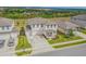 Aerial view showcasing the house and the neighborhood with lush green landscape and other houses in the neighborhood at 2350 Gold Dust Dr, Clermont, FL 34715
