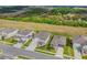 Aerial view showing the house and the neighborhood with lush green landscape and other houses in the neighborhood at 2350 Gold Dust Dr, Clermont, FL 34715