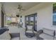 Covered and screened-in back porch for relaxing or dining al fresco, with great views of the outdoors at 2350 Gold Dust Dr, Clermont, FL 34715
