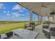 The screened-in back porch features an outdoor kitchen and entertainment area with views of the grassy yard at 2350 Gold Dust Dr, Clermont, FL 34715
