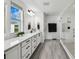 Bright bathroom featuring a modern vanity, quartz countertop, and glass-enclosed shower at 2350 Gold Dust Dr, Clermont, FL 34715