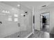 Contemporary bathroom featuring a glass shower with white subway tile and black fixtures at 2350 Gold Dust Dr, Clermont, FL 34715