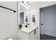 This bathroom includes a modern vanity with quartz countertops and sleek, matte black hardware at 2350 Gold Dust Dr, Clermont, FL 34715