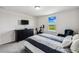 Bedroom featuring a large window, gray carpet, exercise bike, and cozy armchair at 2350 Gold Dust Dr, Clermont, FL 34715
