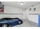 Bedroom showcasing a car-themed bed, gray carpet, and navy dresser against white walls at 2350 Gold Dust Dr, Clermont, FL 34715
