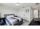 Bedroom featuring a large window, gray carpet, exercise bike, and cozy armchair at 2350 Gold Dust Dr, Clermont, FL 34715