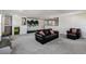 Spacious bonus room includes a comfortable sofa, climbing wall, and built-in storage at 2350 Gold Dust Dr, Clermont, FL 34715