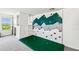 Bonus room with a built-in climbing wall, custom padding, and cubby house at 2350 Gold Dust Dr, Clermont, FL 34715