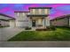 Beautiful two-story home with a two car garage and a manicured front yard at 2350 Gold Dust Dr, Clermont, FL 34715