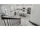 Open kitchen featuring an island, stainless appliances, and access to outdoor living space at 2350 Gold Dust Dr, Clermont, FL 34715