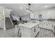 Bright, open kitchen featuring a central island, white cabinets, and stainless steel appliances at 2350 Gold Dust Dr, Clermont, FL 34715
