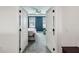 Entryway view into a main bedroom with a tray ceiling and tranquil blue walls at 2350 Gold Dust Dr, Clermont, FL 34715