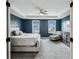 Main bedroom with tray ceiling, large windows, and a calming color scheme at 2350 Gold Dust Dr, Clermont, FL 34715