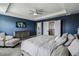 Main bedroom with tray ceiling, calming paint, and direct access to ensuite bath and closets at 2350 Gold Dust Dr, Clermont, FL 34715