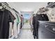 Spacious walk-in closet with custom shelving, ample storage, and carpet flooring at 2350 Gold Dust Dr, Clermont, FL 34715