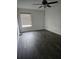 Bedroom featuring modern ceiling fan and hardwood flooring with natural lighting at 2450 Sweetwater Country Club Dr, Apopka, FL 32712