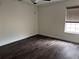 This is a bedroom with modern floors and a ceiling fan with an attached light at 2450 Sweetwater Country Club Dr, Apopka, FL 32712