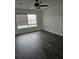 Bedroom featuring modern ceiling fan and hardwood flooring with natural lighting at 2450 Sweetwater Country Club Dr, Apopka, FL 32712