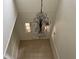 Foyer featuring a decorative chandelier, tiled floor, and a brightly-lit front door at 2450 Sweetwater Country Club Dr, Apopka, FL 32712