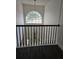 A foyer with high ceilings, a chandelier, and railing overlooking the front entry at 2450 Sweetwater Country Club Dr, Apopka, FL 32712