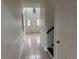 Inviting foyer with tile flooring, chandelier, and staircase at 2450 Sweetwater Country Club Dr, Apopka, FL 32712