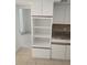 Kitchen area with white cabinets and open shelving at 2450 Sweetwater Country Club Dr, Apopka, FL 32712
