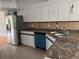 Kitchen view featuring stainless steel refrigerator and updated sink at 2450 Sweetwater Country Club Dr, Apopka, FL 32712
