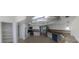 Panoramic kitchen view showcasing a large pantry and updated appliances at 2450 Sweetwater Country Club Dr, Apopka, FL 32712