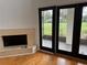 The living room features a fireplace and glass doors to outdoor view at 2450 Sweetwater Country Club Dr, Apopka, FL 32712