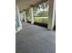 Enclosed patio with a view of the lawn and surrounding greenery for outdoor relaxation at 2450 Sweetwater Country Club Dr, Apopka, FL 32712