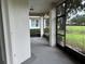 Enclosed patio overlooking a green lawn and neighborhood landscape for outdoor enjoyment at 2450 Sweetwater Country Club Dr, Apopka, FL 32712