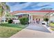 Charming single-story home with a welcoming screened-in porch and covered carport with picket fence at 2475 Karen Dr, Mount Dora, FL 32757