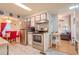 Updated kitchen with stainless steel appliances and tile flooring leads into a cozy living area at 2475 Karen Dr, Mount Dora, FL 32757