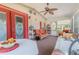 Relaxing screened-in porch with comfortable seating and ceiling fan at 2475 Karen Dr, Mount Dora, FL 32757
