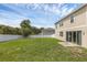 Expansive fenced backyard with lush green grass, perfect for outdoor activities and relaxation at 2532 Autumn Stream Dr, Leesburg, FL 34748